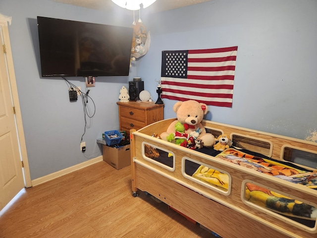 bedroom with light wood-type flooring