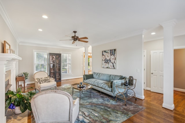 living room with ornamental molding, ceiling fan, and dark hardwood / wood-style flooring