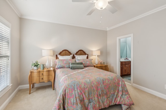 carpeted bedroom with multiple windows, ornamental molding, ensuite bath, and ceiling fan