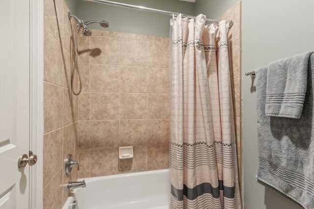 bathroom with shower / bath combo