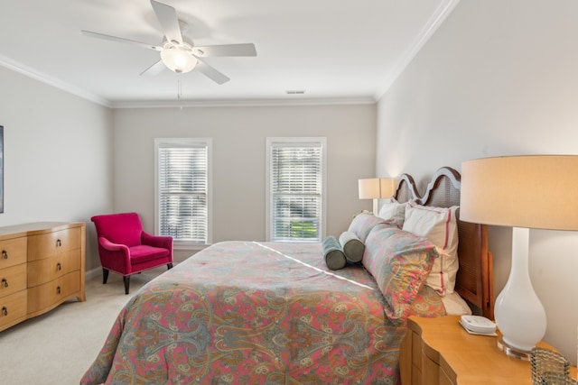 carpeted bedroom with crown molding and ceiling fan