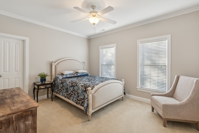 bedroom featuring ceiling fan, light carpet, multiple windows, and crown molding