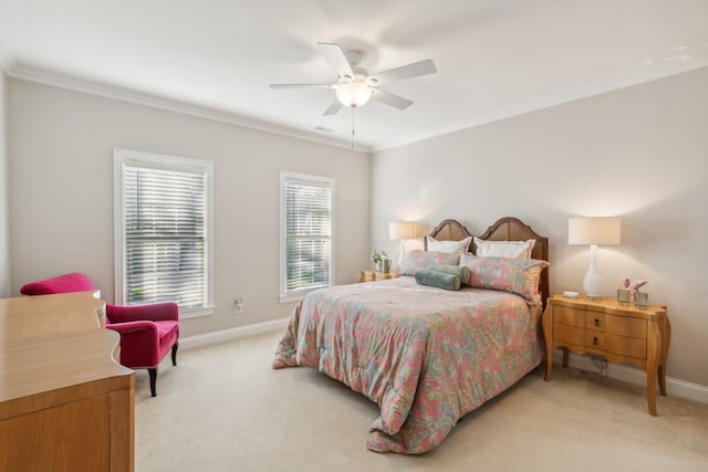 bedroom with ceiling fan, crown molding, and light colored carpet