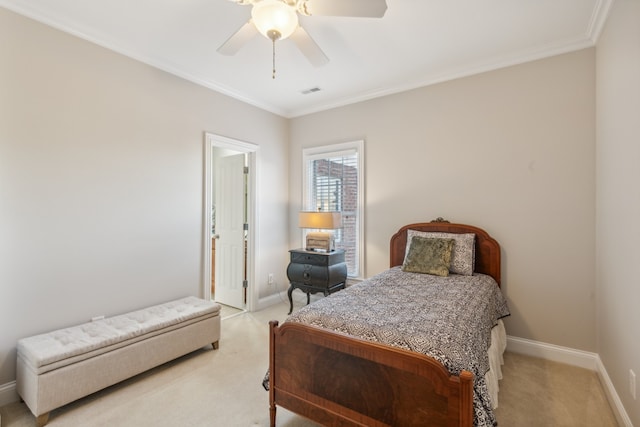 bedroom with crown molding, light colored carpet, and ceiling fan