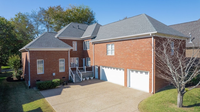 exterior space with a yard and a garage