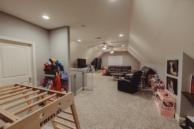 recreation room featuring ceiling fan, carpet flooring, and lofted ceiling