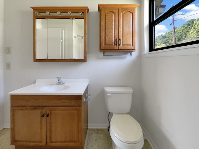 bathroom featuring toilet and vanity