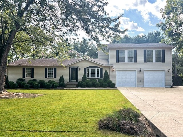 view of front of house featuring a front yard and a garage