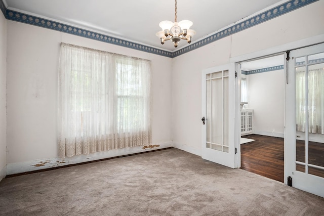 361 New Middleton Hwy, Gordonsville, TN 38563 - empty room with carpet floors, baseboards, french doors, and an inviting chandelier