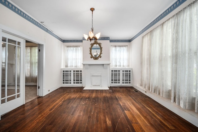 361 New Middleton Hwy, Gordonsville, TN 38563 - unfurnished living room with hardwood / wood-style floors, a brick fireplace, a chandelier, and ornamental molding