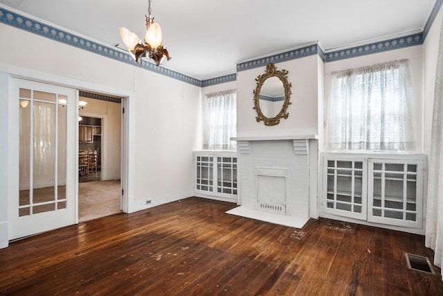 361 New Middleton Hwy, Gordonsville, TN 38563 - unfurnished living room featuring a chandelier, a fireplace, hardwood / wood-style flooring, and visible vents