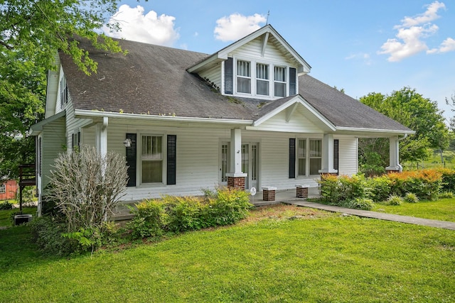 361 New Middleton Hwy, Gordonsville, TN 38563 - view of front facade with a porch, a shingled roof, and a front lawn