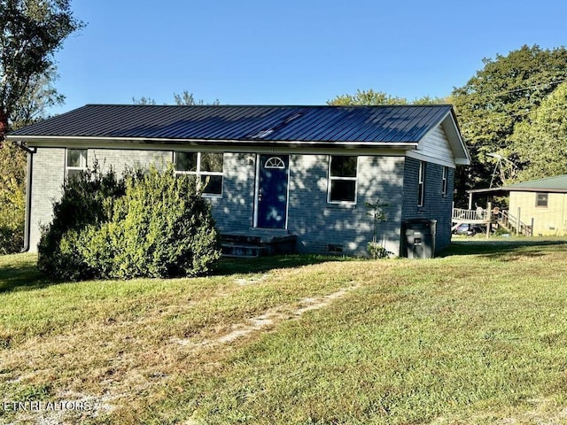 131 Christie Cir, Red Boiling Springs, TN 37150 - bungalow featuring brick siding, entry steps, a front yard, and metal roof