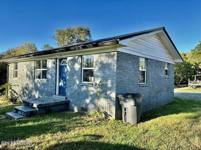 131 Christie Cir, Red Boiling Springs, TN 37150 - exterior space with crawl space, brick siding, and a front yard