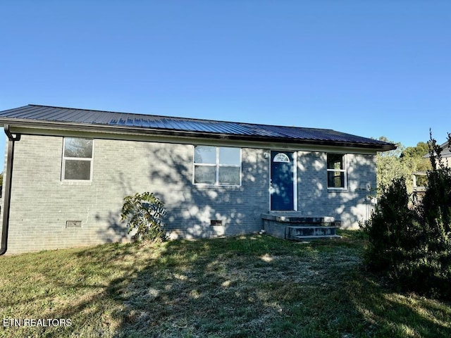 131 Christie Cir, Red Boiling Springs, TN 37150 - rear view of house featuring brick siding, a lawn, crawl space, and metal roof