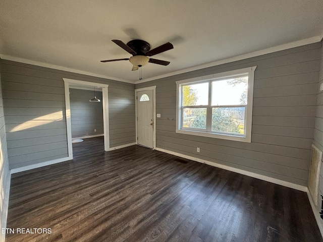 131 Christie Cir, Red Boiling Springs, TN 37150 - entryway featuring a ceiling fan, baseboards, dark wood-style flooring, and wood walls