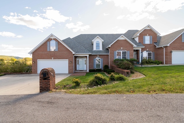 view of front of property featuring a garage and a front lawn