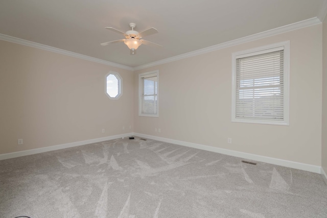 unfurnished room featuring crown molding, carpet, and ceiling fan