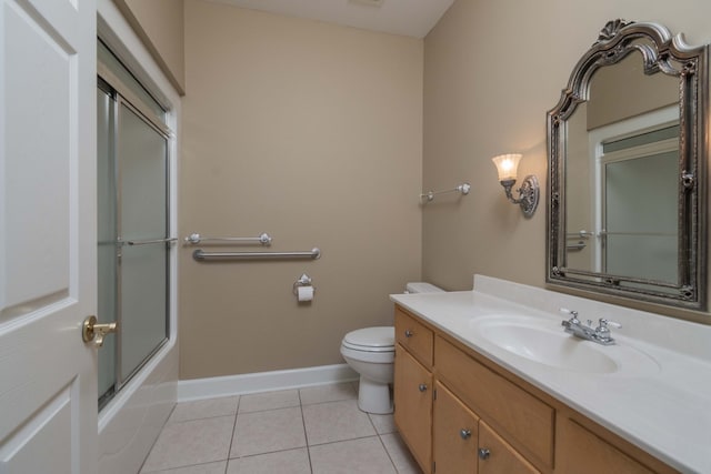 full bathroom featuring vanity, toilet, tile patterned floors, and enclosed tub / shower combo