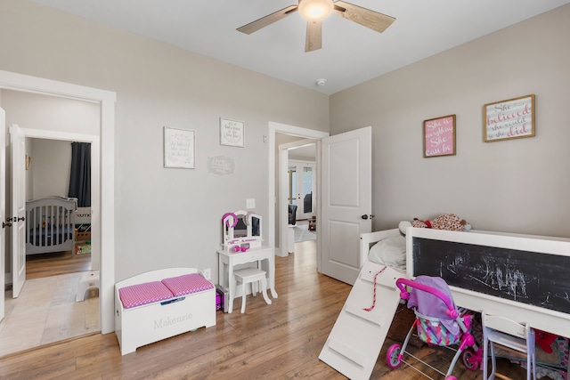 bedroom featuring hardwood / wood-style flooring and ceiling fan