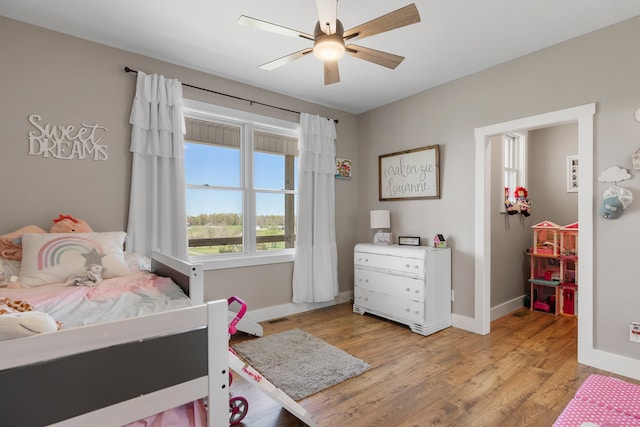 bedroom featuring ceiling fan and light hardwood / wood-style flooring