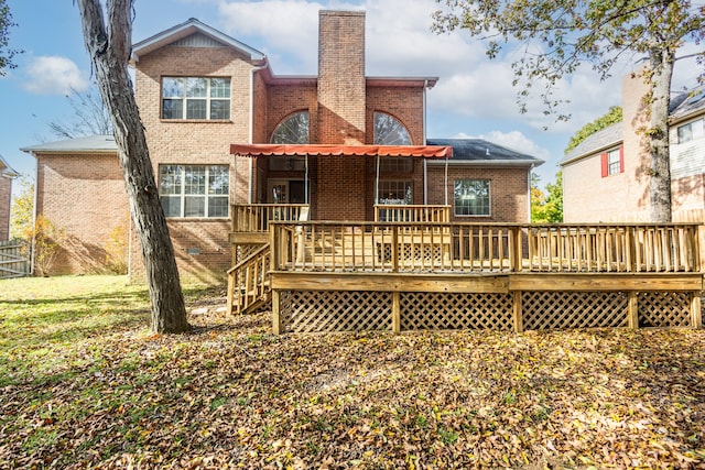 back of house featuring a wooden deck