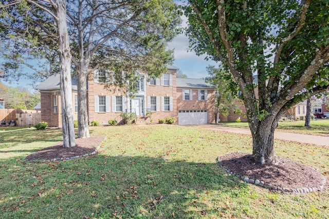 view of front of house featuring a garage and a front yard