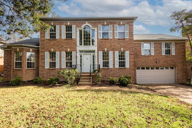 view of front of property with a garage and a front yard