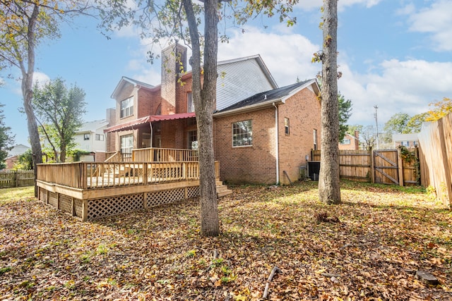 back of house featuring a wooden deck