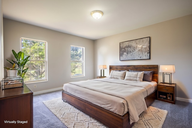 bedroom with dark carpet