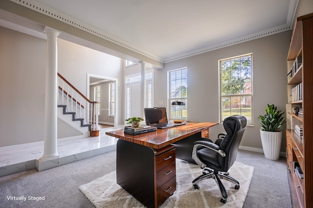 office with light colored carpet and decorative columns