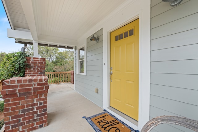 property entrance with covered porch