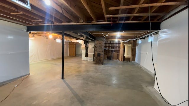 basement featuring heating unit