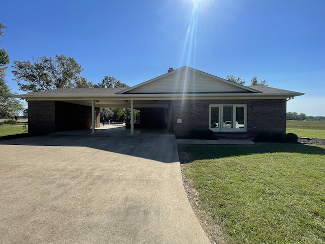 ranch-style house with a carport and a front yard