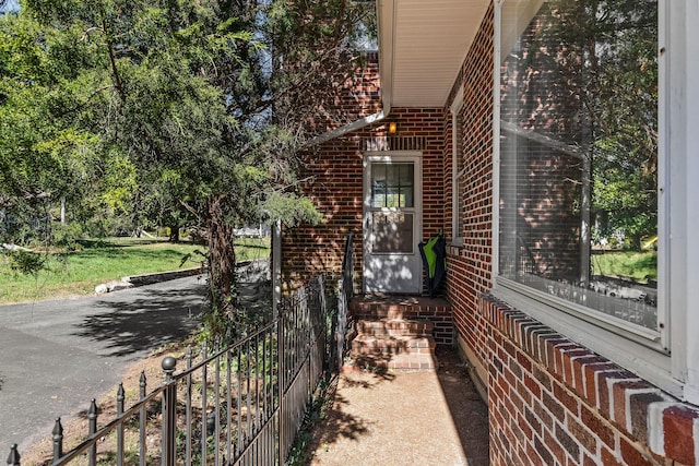 view of side of property with brick siding