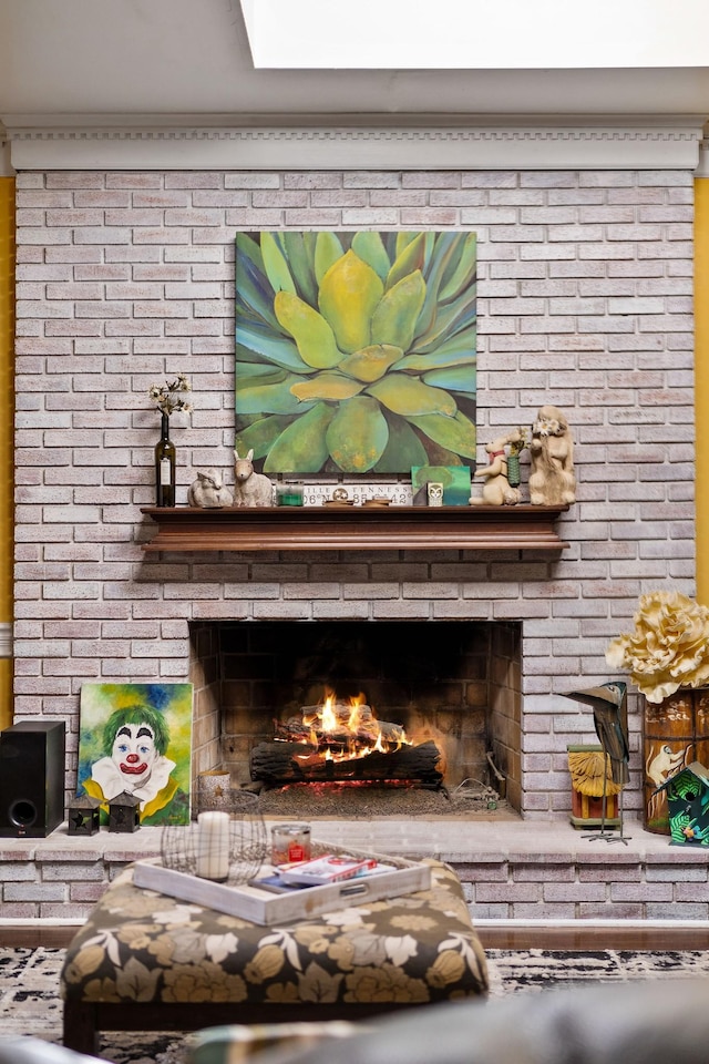 room details with crown molding and a fireplace