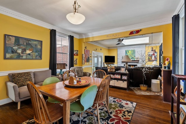 dining space featuring crown molding, baseboards, and dark wood-type flooring