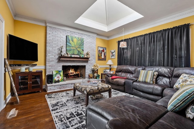 living area featuring visible vents, crown molding, a brick fireplace, dark wood finished floors, and a tray ceiling