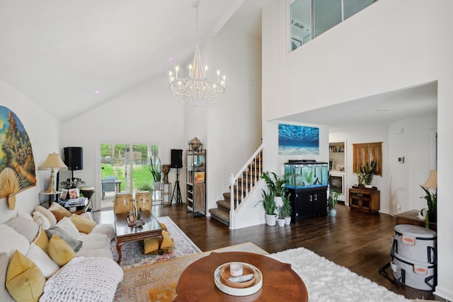 living room featuring a chandelier, high vaulted ceiling, and dark hardwood / wood-style flooring