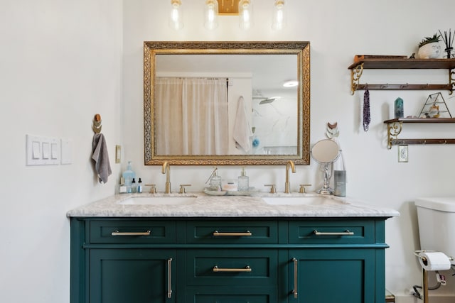 bathroom with vanity, a shower, and toilet