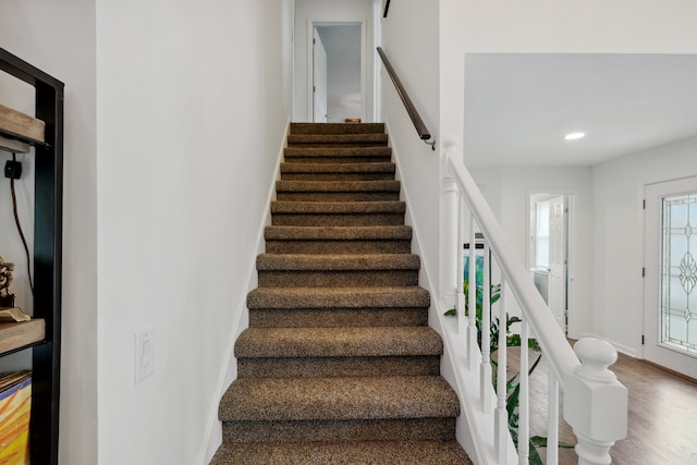 stairs with wood-type flooring