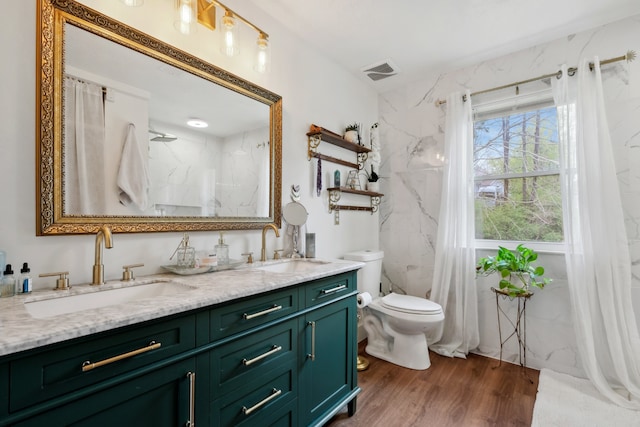 bathroom with vanity, toilet, a shower with curtain, and hardwood / wood-style floors