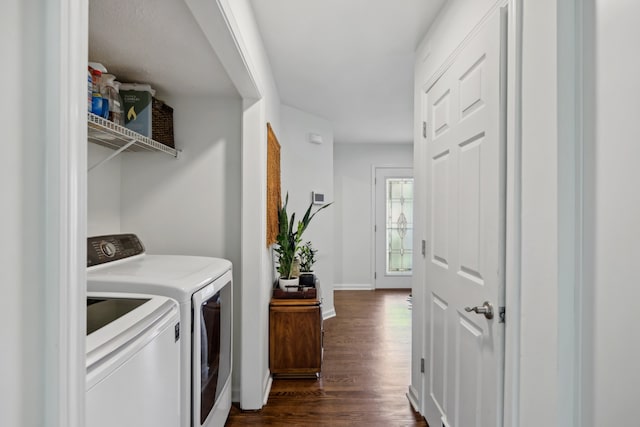 laundry area with washing machine and dryer and dark hardwood / wood-style floors