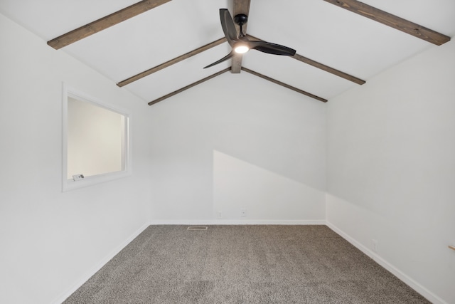 empty room featuring carpet floors, lofted ceiling with beams, and ceiling fan