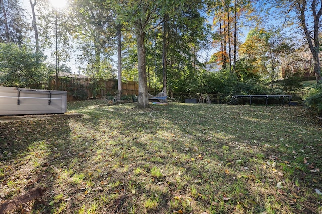 view of yard featuring a trampoline