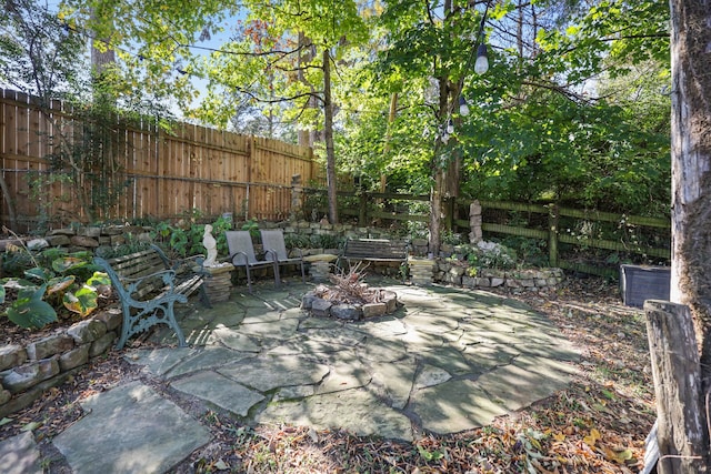 view of patio / terrace with a fire pit