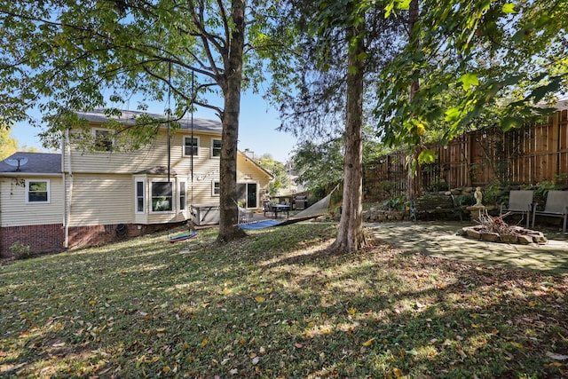 view of yard with a patio area and an outdoor fire pit