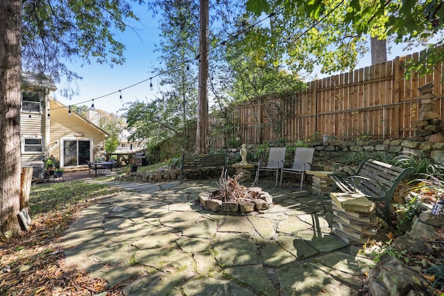 view of patio featuring an outdoor fire pit