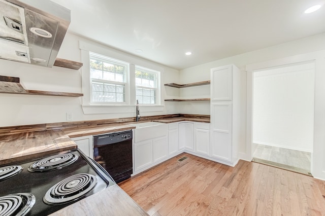 kitchen with light hardwood / wood-style floors, dishwasher, white cabinets, and range