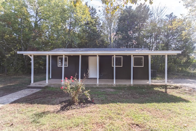 view of outdoor structure featuring a lawn